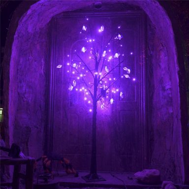 decorate a halloween tree purple lights and spooky bats