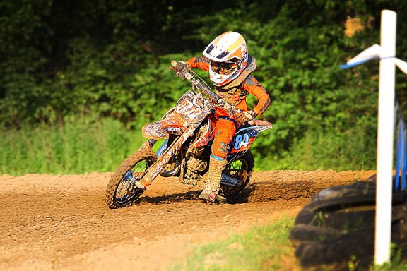 tween riding a motocross dirt bike