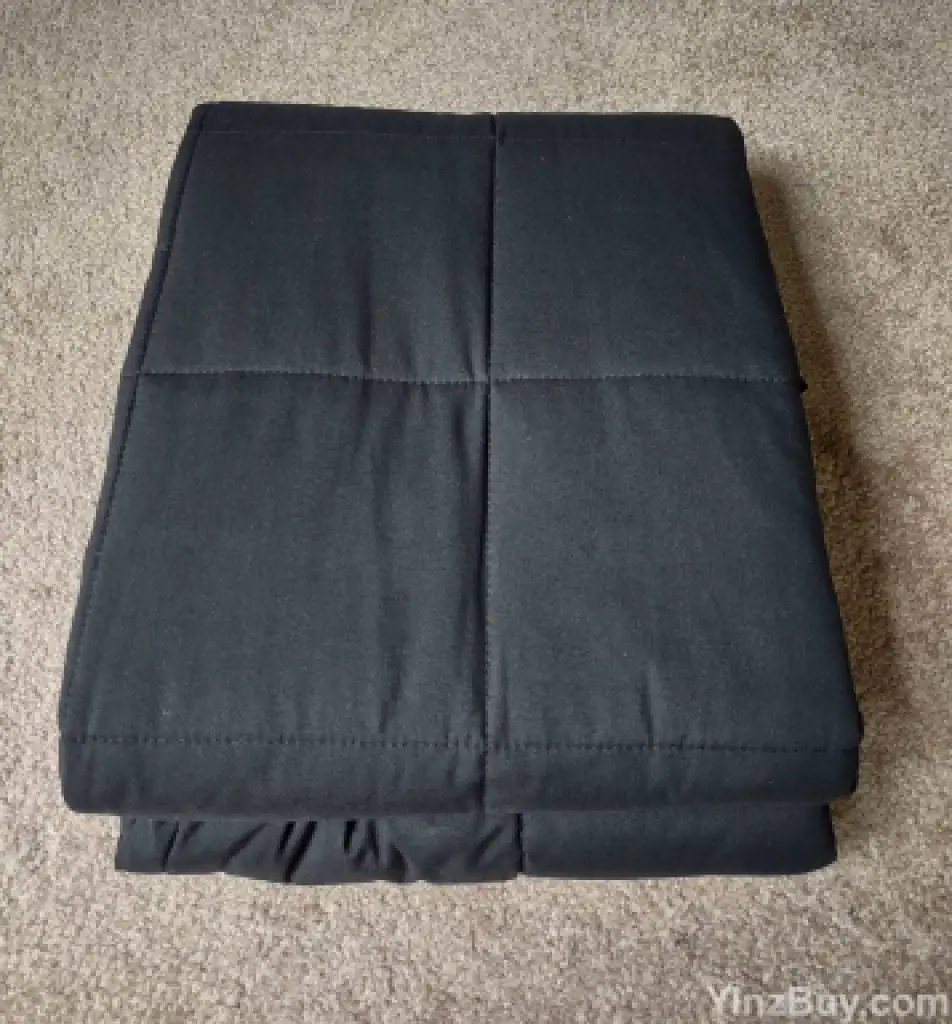 use a gift bag to wrap a weighted blanket step 1 fold or roll blanket copyright yinzbuy