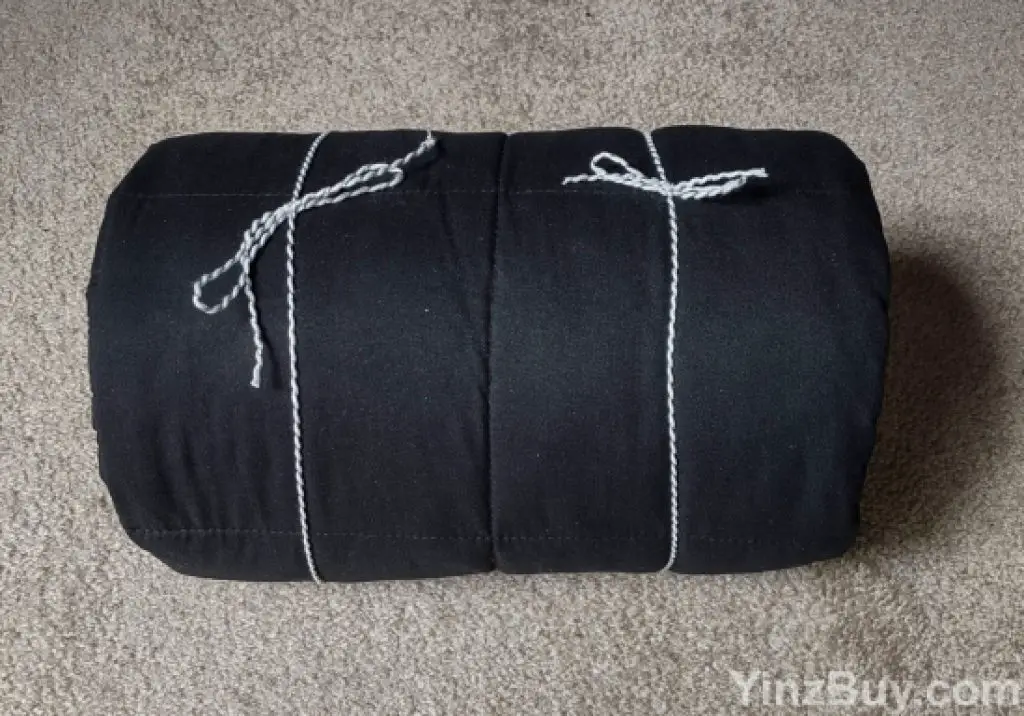 use a gift bag to wrap a weighted blanket step 2 secure with string copyright yinzbuy